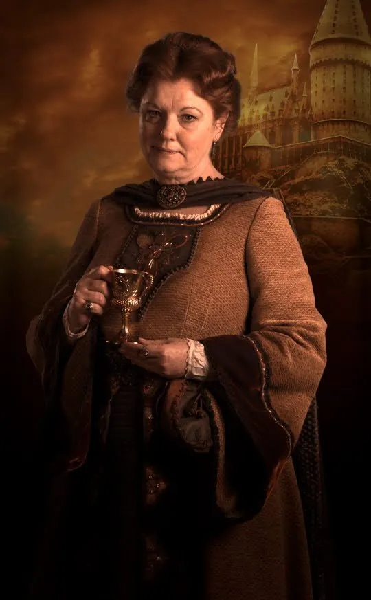 Autumn founder's portrait composite: a woman in a brown embroidered gown holding a golden goblet, with the castle behind her